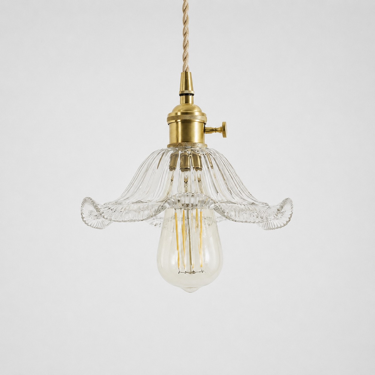 Style N textured glass shade with antique brass E27 socket, front view