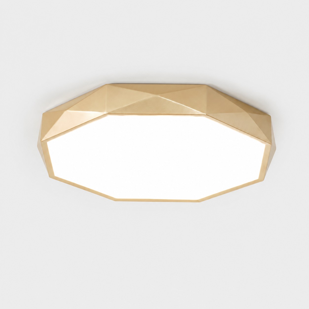 Large gold faceted ceiling light in bright white mode