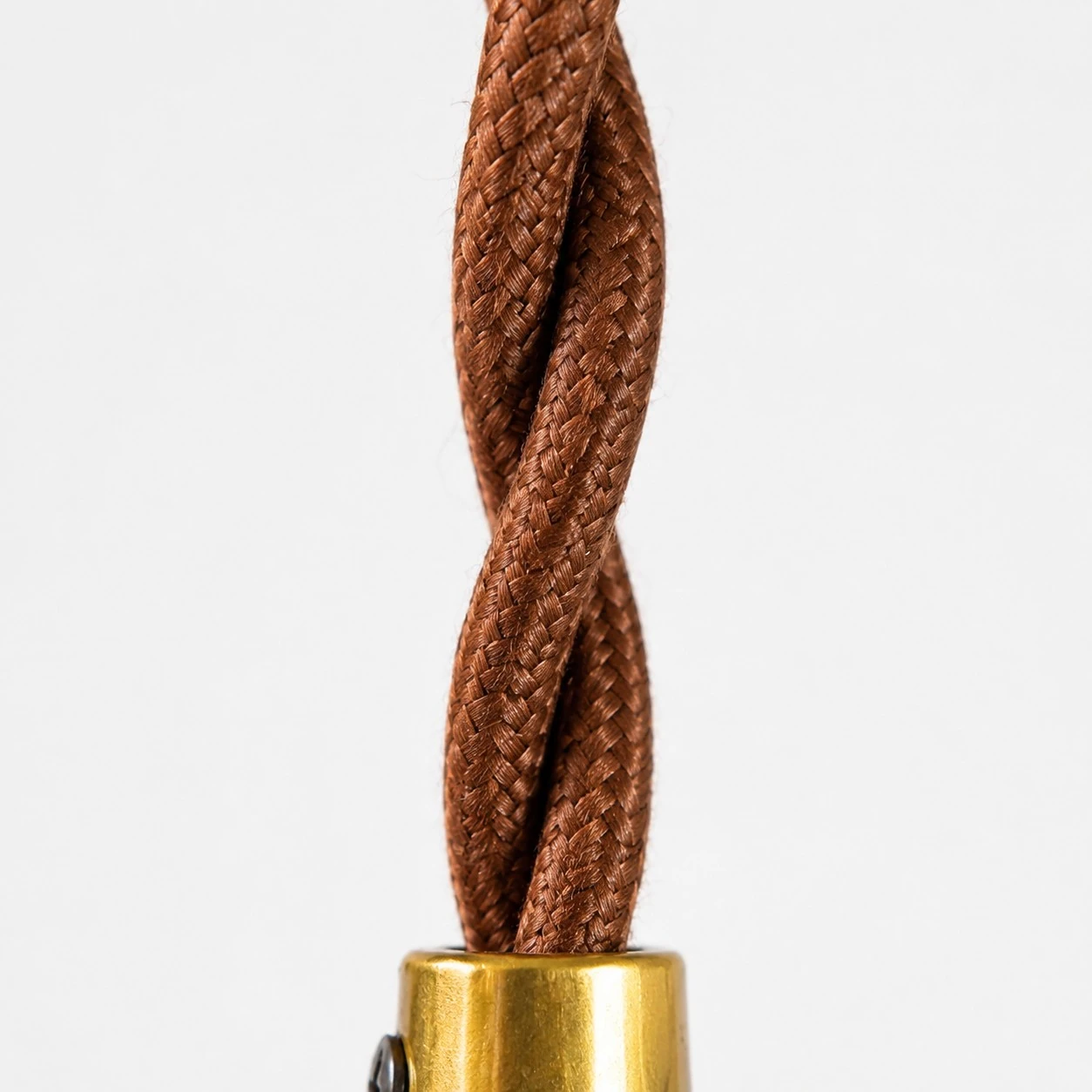 Close view of the brown braided pendant cord