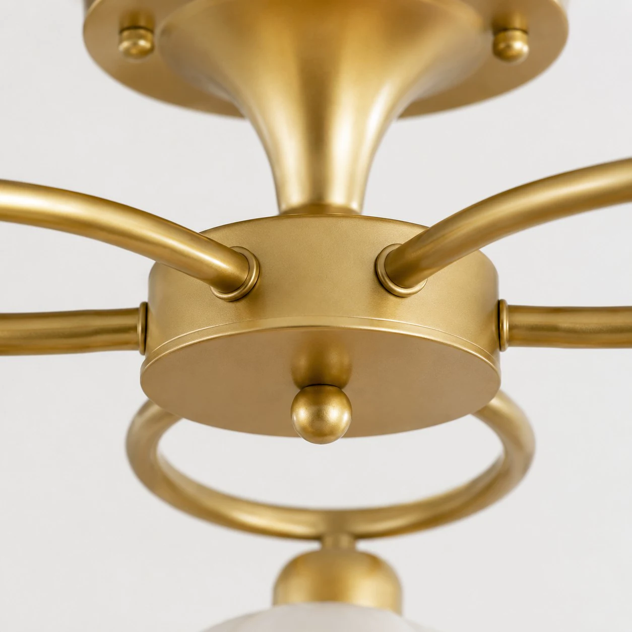 Brass center connection and curved arm detail