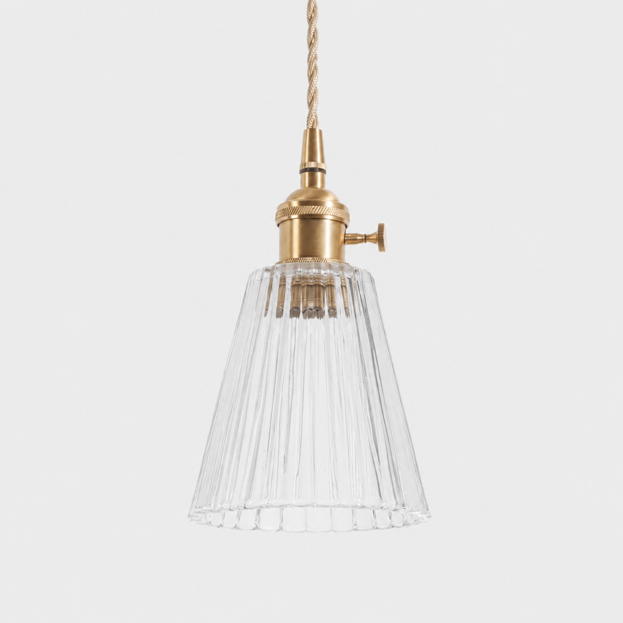 Style K textured glass shade with antique brass E27 socket, front view
