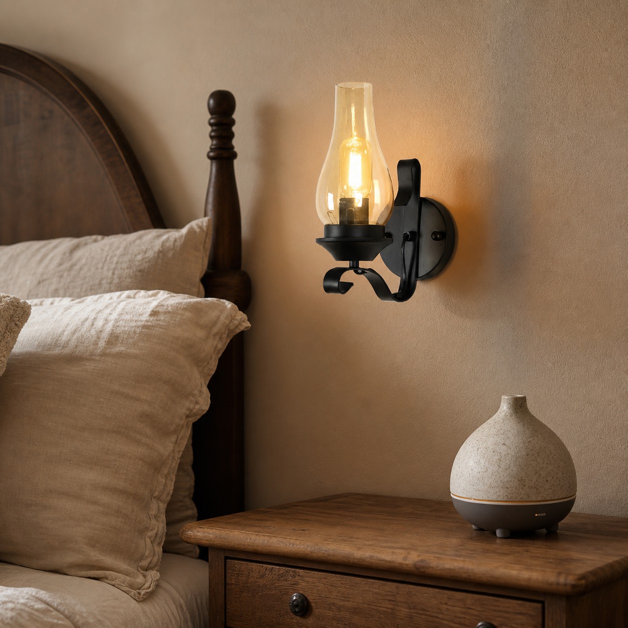 Industrial kerosene style wall lamp mounted beside a bed